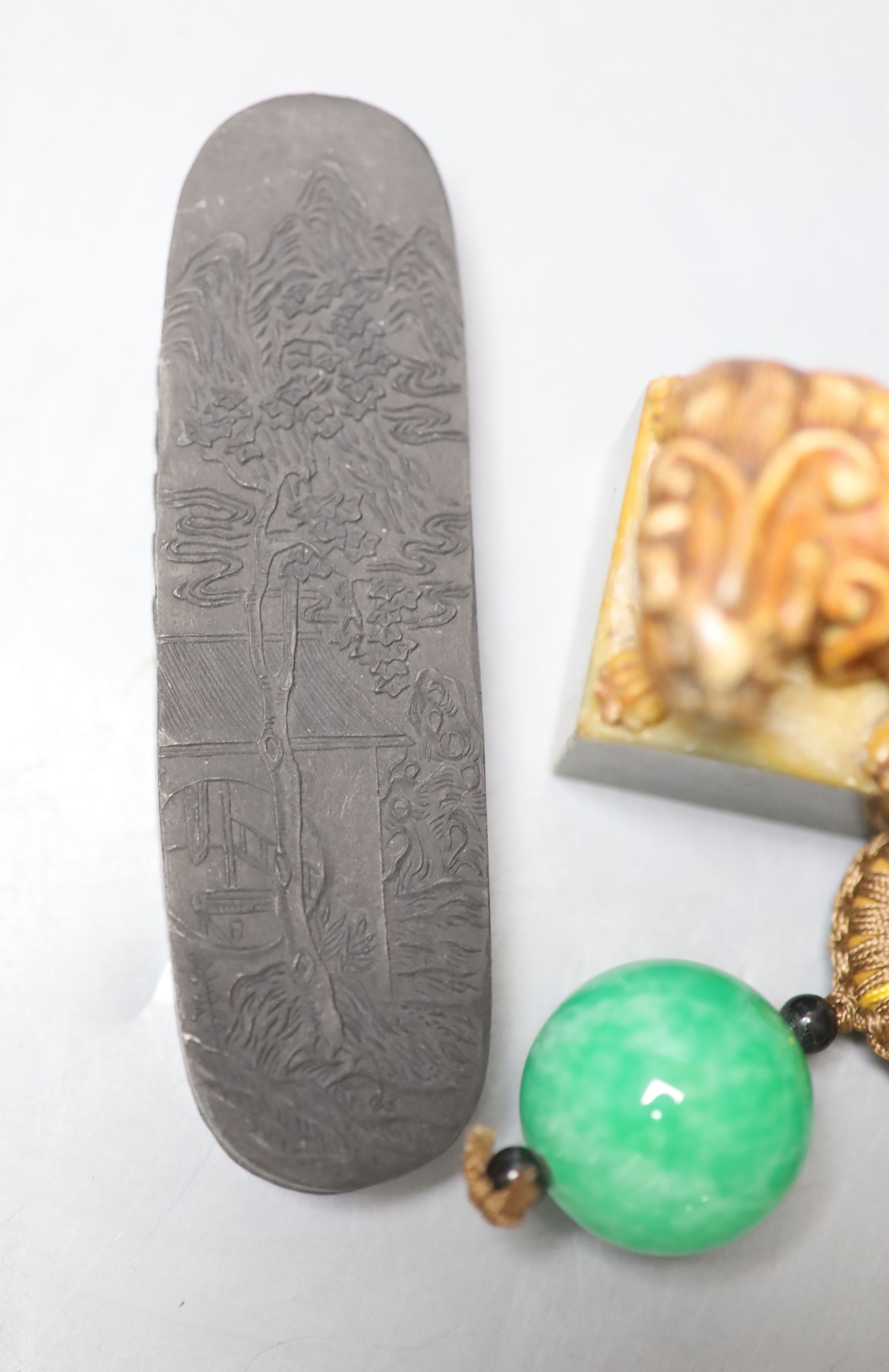 Assorted Chinese small items including two Chinese inkstones, a similar hardstone seal and pendant